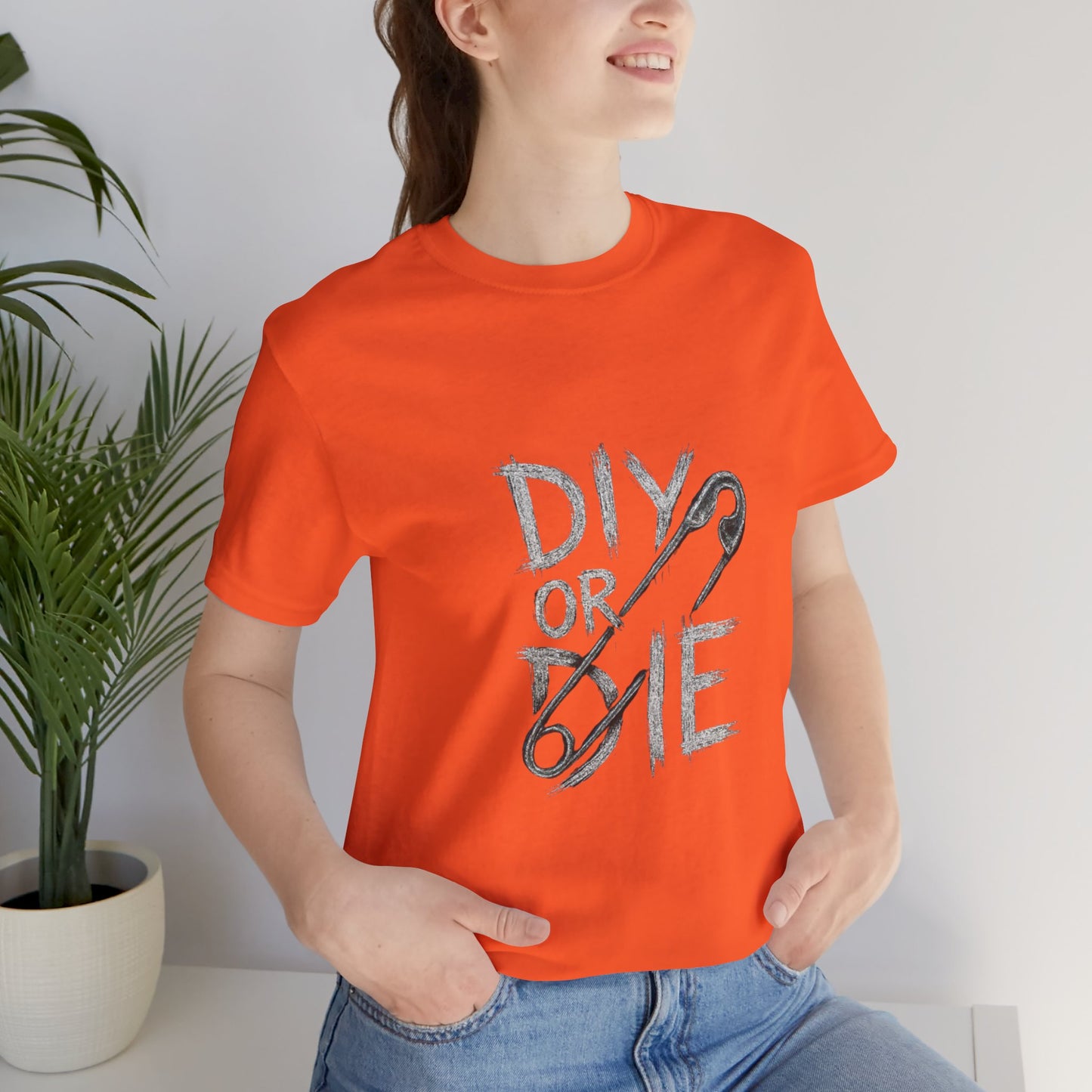 Punk Tee with Hand-Drawn Text and Glitched Safety Pin